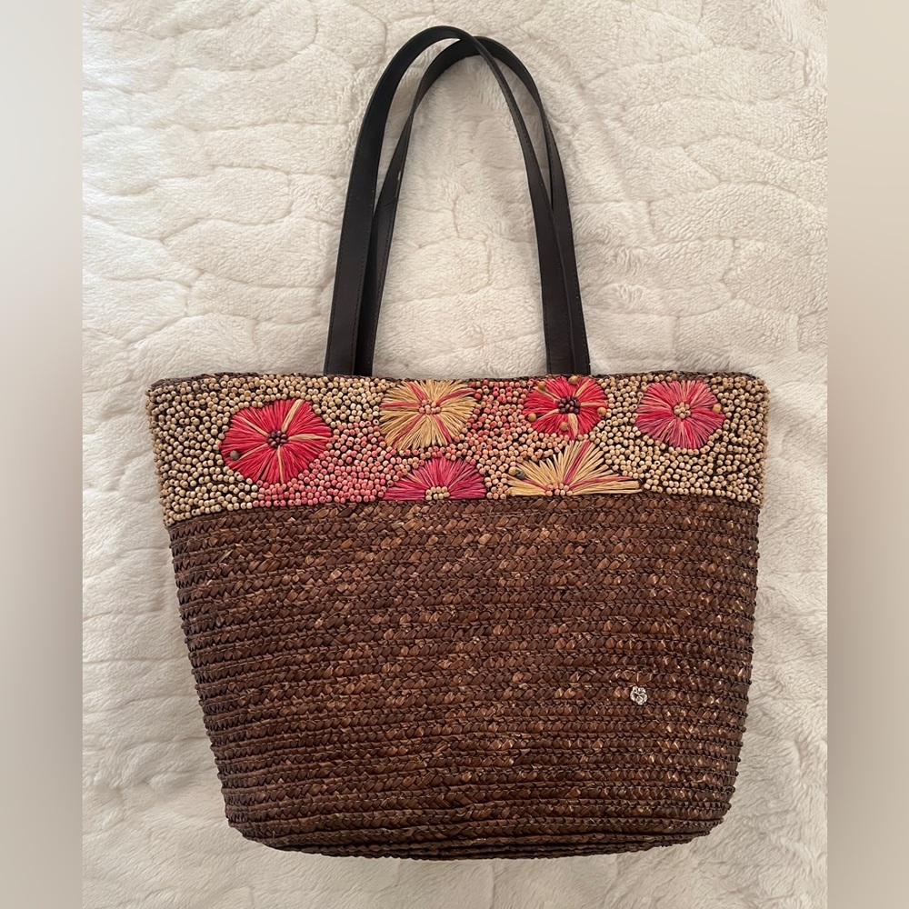 Flora Bella large woven straw tote bag with a floral beaded design.